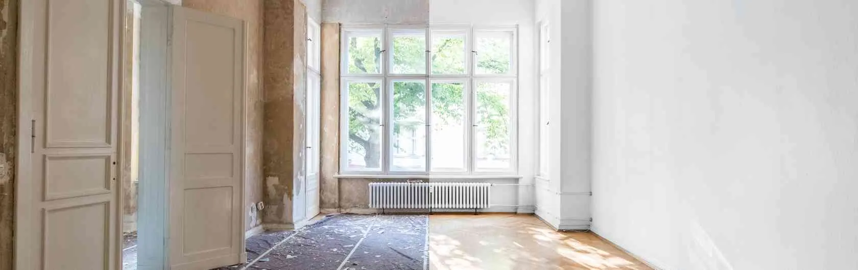 Symbolisiert wird das Thema Wände sanieren für mehr Energieeffizienz und Nachhaltigkeit durch eine renovierungsbedürftige Wohnung, bei der die Wände saniert werden. Es handelt sich um eine Altbauwohnung mit hohen Decken.